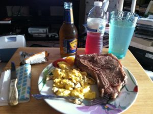 Post-race tradition - steak and eggs, with water, Ultima, and Hornsby cider (Guinness for John). Yum!