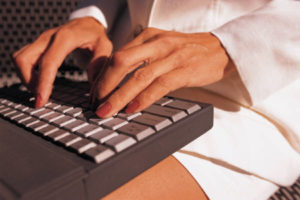 woman typing on keyboard